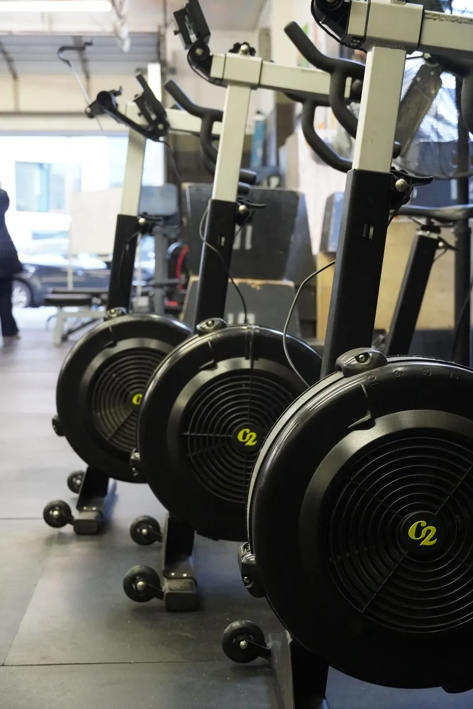 A row of Concept2 BikeErgs ready for class at Whit Fitness